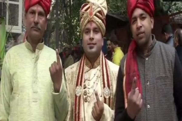 Dressed in wedding attire, groom turns up to vote with family in Delhi Dressed in wedding attire, groom turns up to vote with family in Delhi
