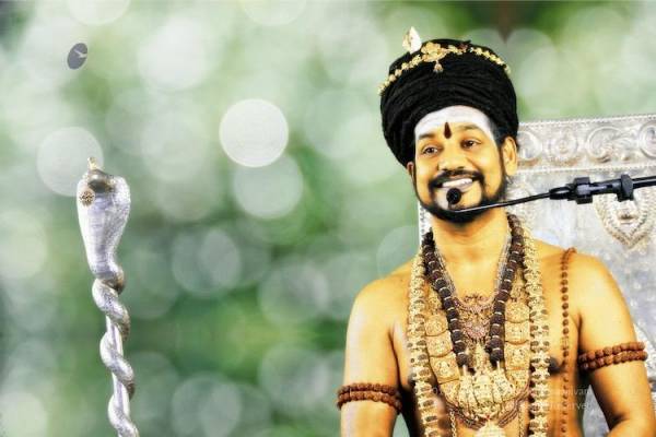 Nithyananda is on spiritual tour, can't serve him notice: K'taka cops Nithyananda is on spiritual tour, can't serve him notice: K'taka cops