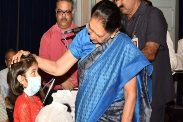 UP Governor Anandiben Patel adopts girl child suffering from TB News Image